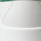 Chic White Sneakers with Green Heel Accent
