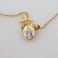 Elegant Gold Tone Charm Necklace with Cross Pendant