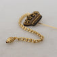 Elegant Gold Tone Glass-Accented Brooch Pin