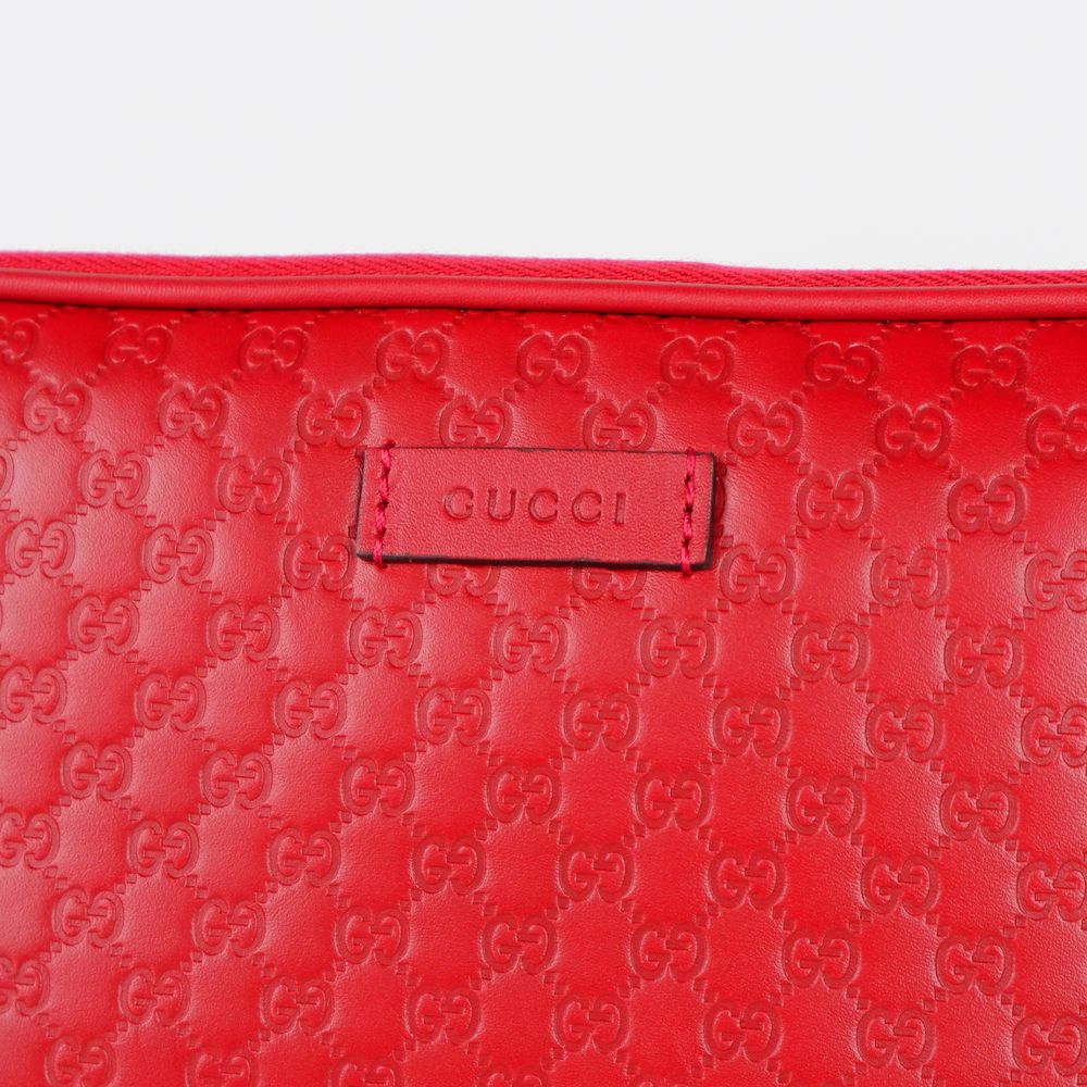 Elegant Microguccissima Leather Clutch in Red