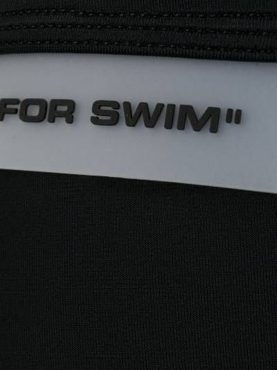 Sleek Black Swim Briefs with Iconic Logo Detail